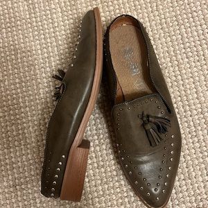 Mi. im green shoes with studs.